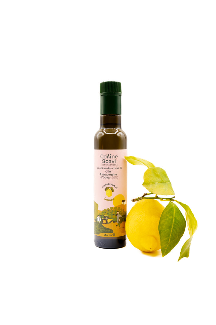 Bottiglia di Olio Aromatizzato Colline Soavi al gusto Limone con accanto un limone